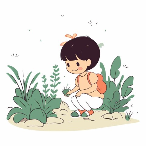 Cute little girl sitting on the ground in the garden