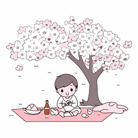 Boy with a picnic in a cherry blossom garden