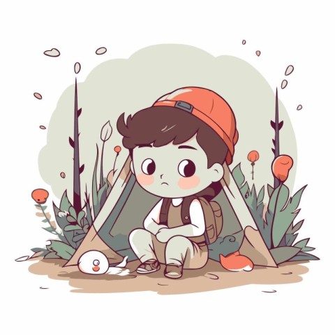 Boy scout sitting on the ground in the forest.