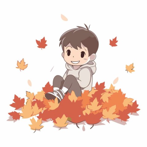 Cute little boy sitting on the autumn leaves.