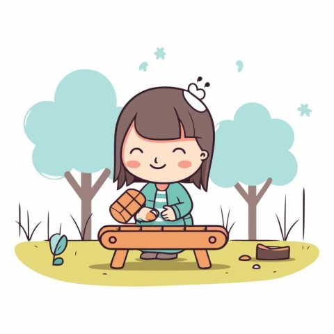 Cute little girl playing xylophone in the park.