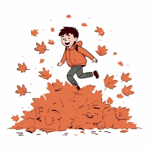 Happy boy jumping on a pile of fallen leaves in autumn